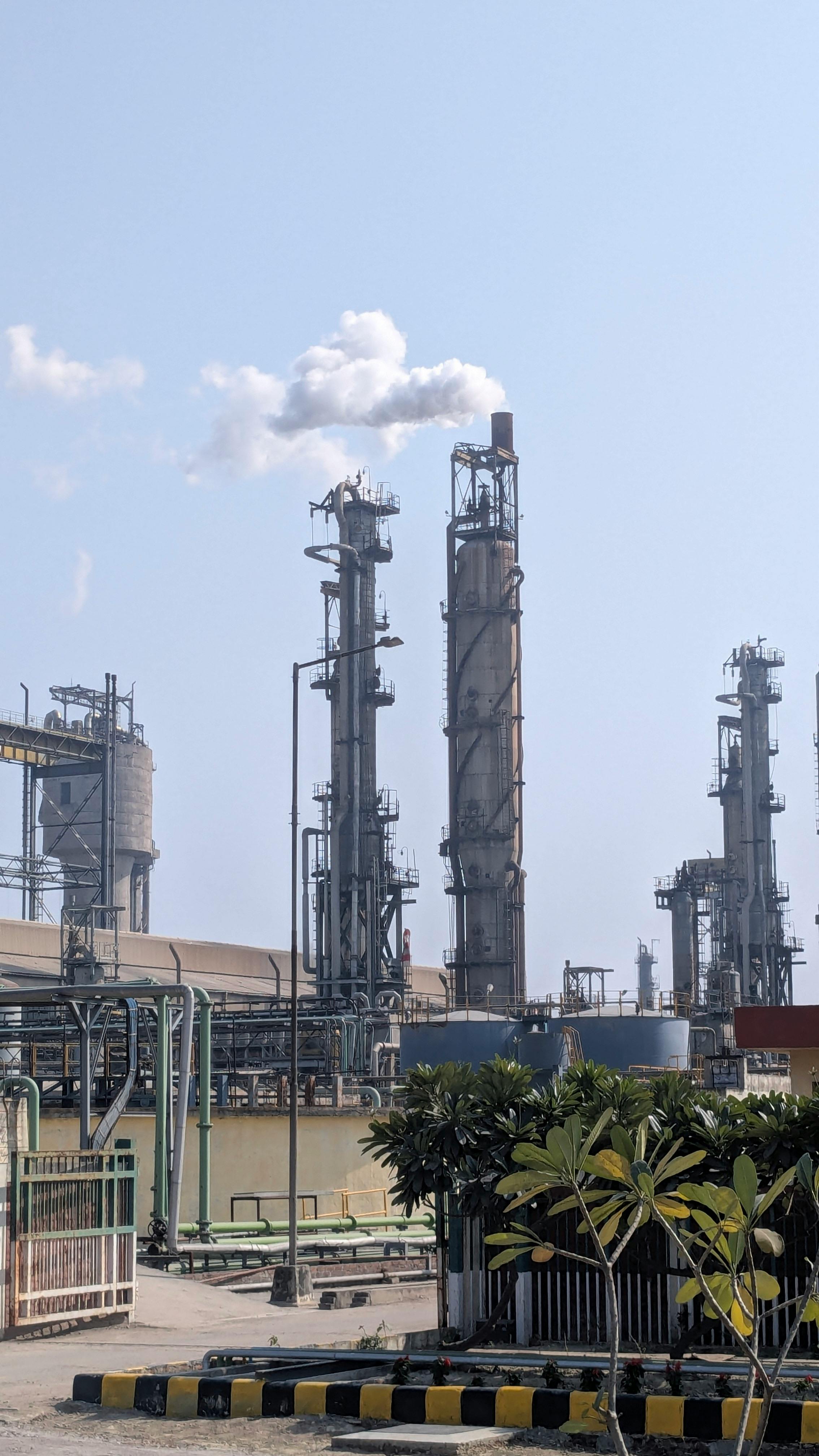 Maharashtra industrial planning team reviewing site development blueprints